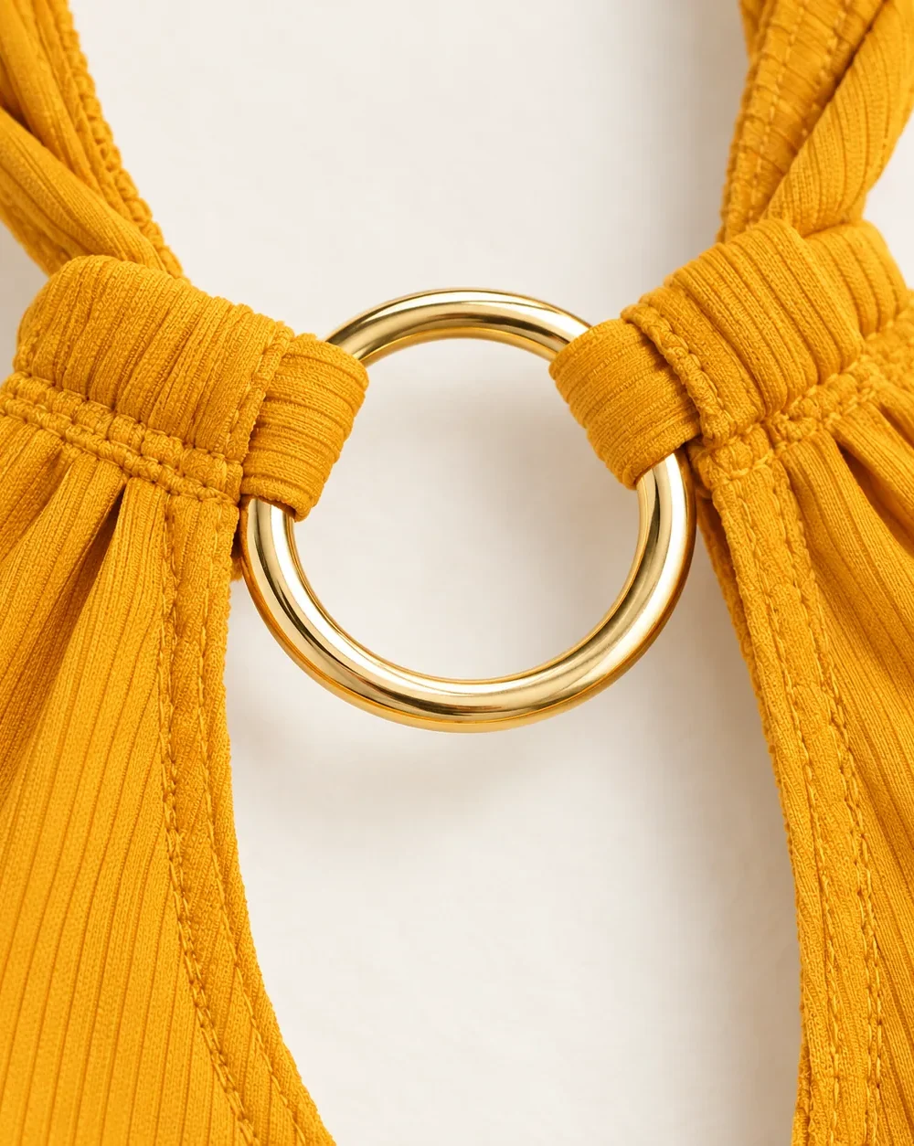 Corona Halter One-piece, close-up of the gold ring