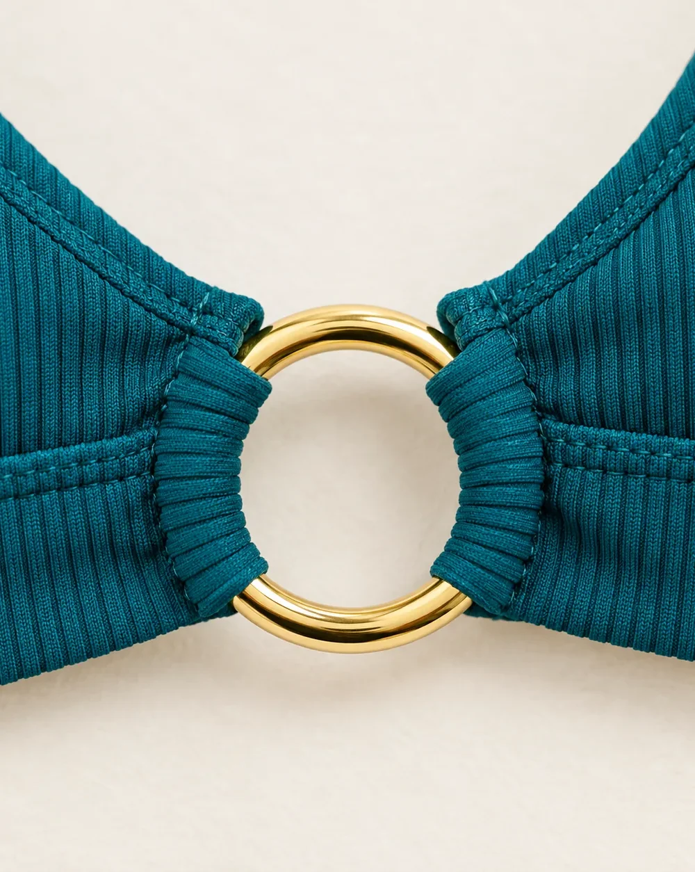 Corona Longline Top, close-up of the gold ring