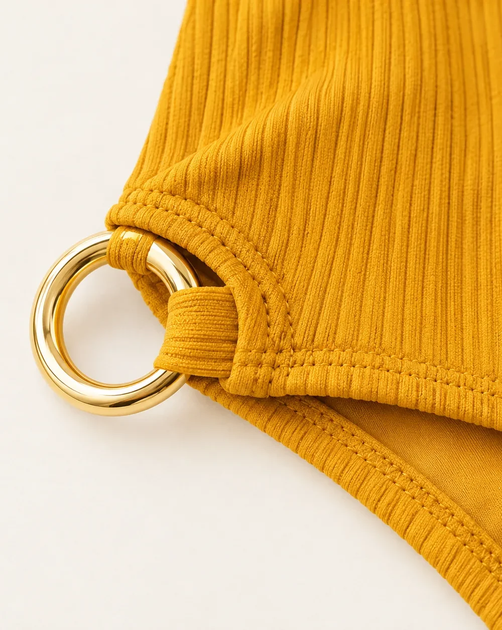 Equinox Boyleg Bottom, close-up of the gold ring