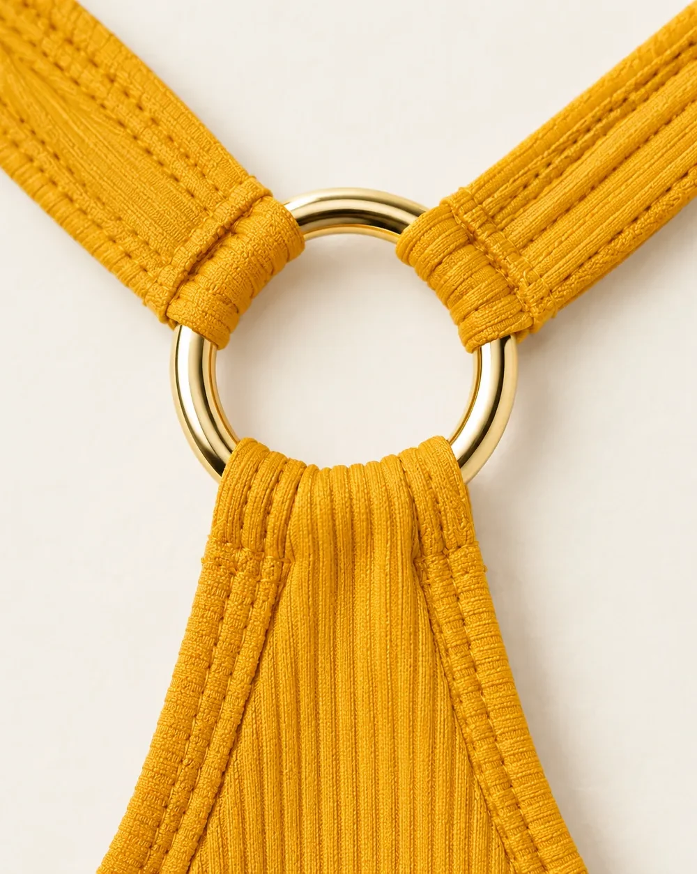 Equinox Racer Top, close-up of the gold ring