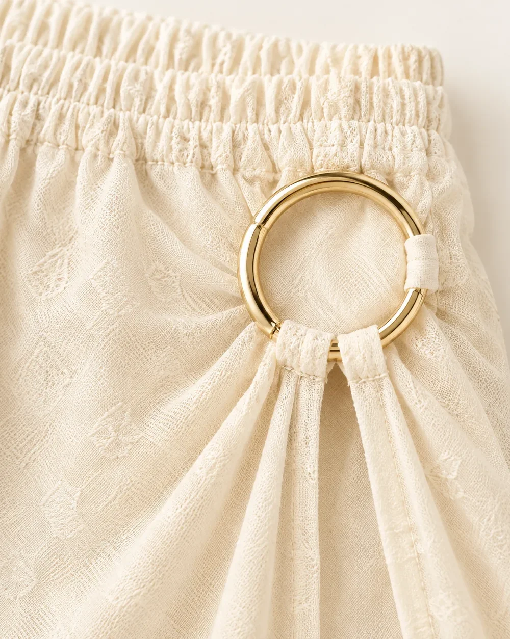 Halo Mesh Maxi Skirt, close-up of the gold ring