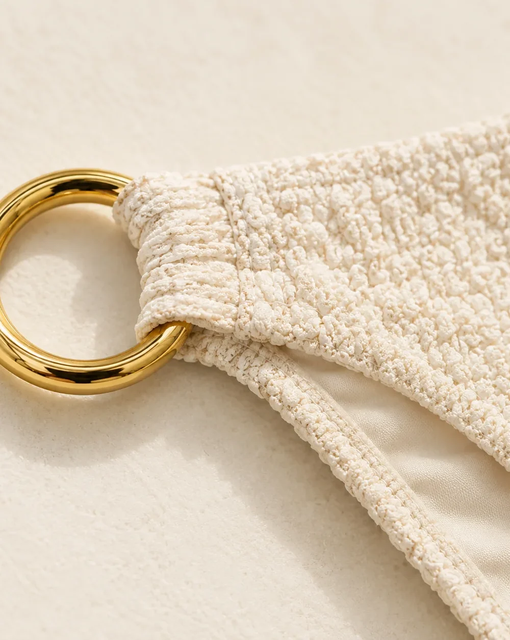 Orbit Low-rise Bottom, close-up of the gold ring