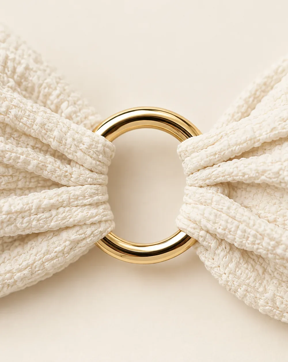 Orbit Twist Bandeau Top, close-up of the gold ring