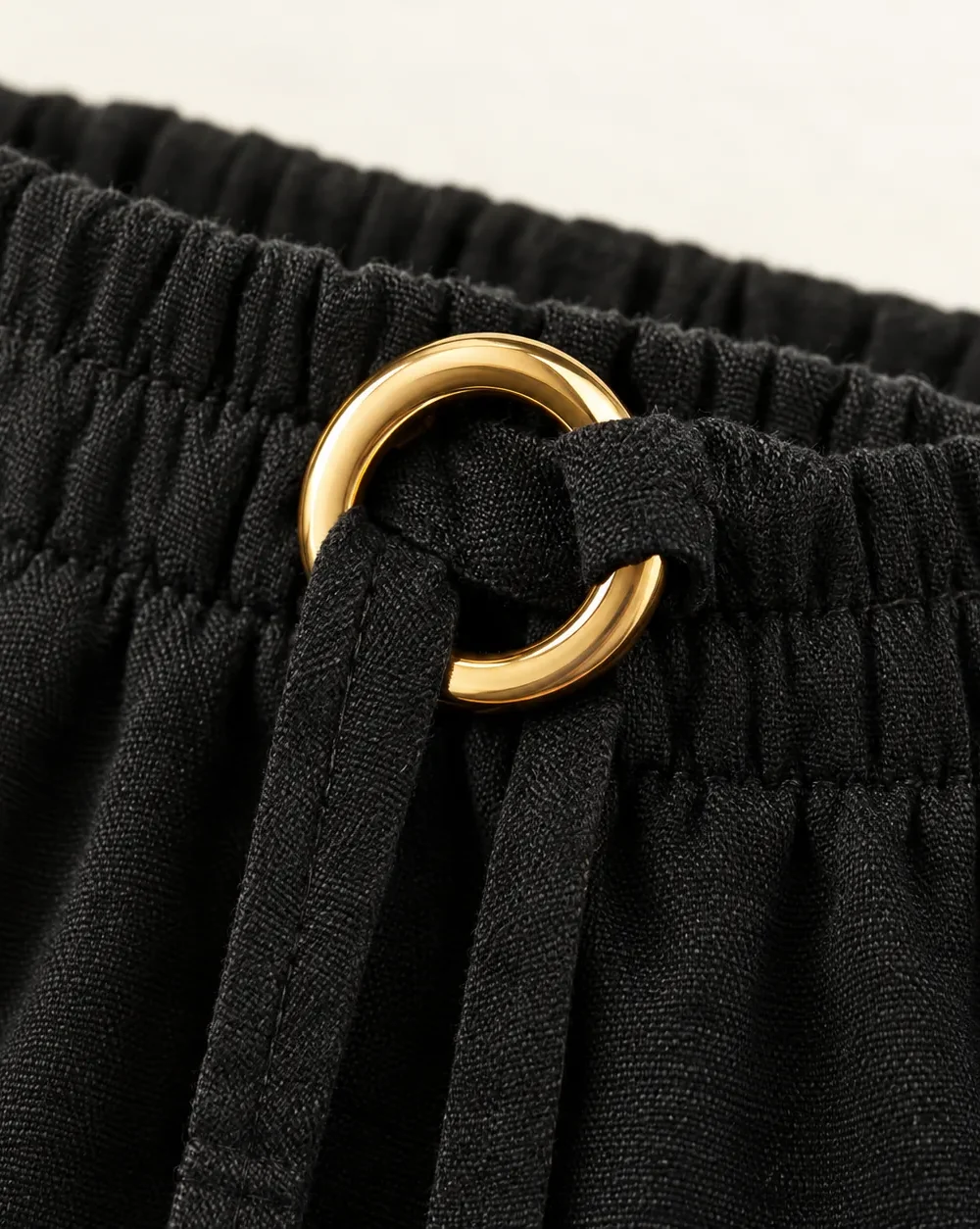 Ring-tie Wide-leg Beach Pants, close-up of the gold ring